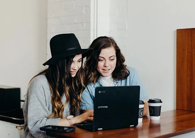 Two Girls w-laptop-webp